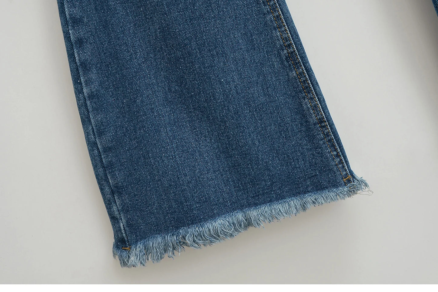 Flared jeans with rips at the knees