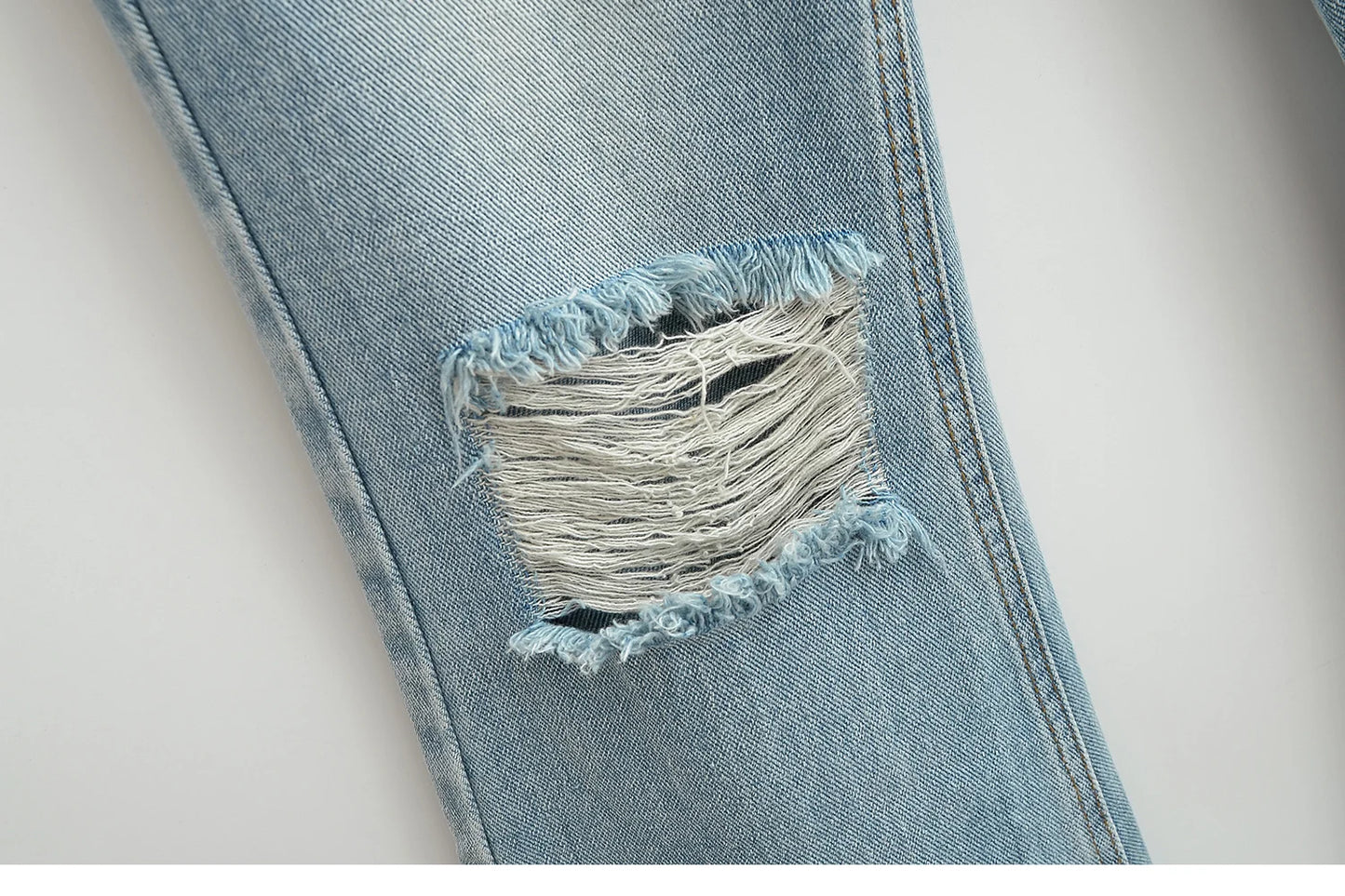Flared jeans with rips at the knees
