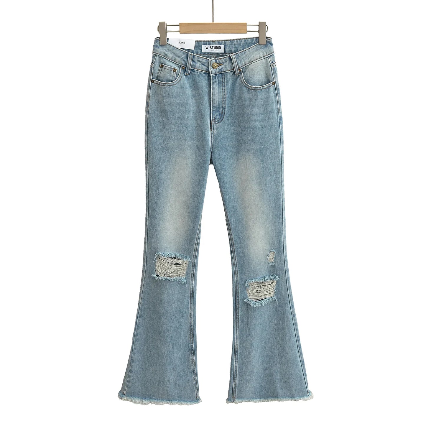 Flared jeans with rips at the knees