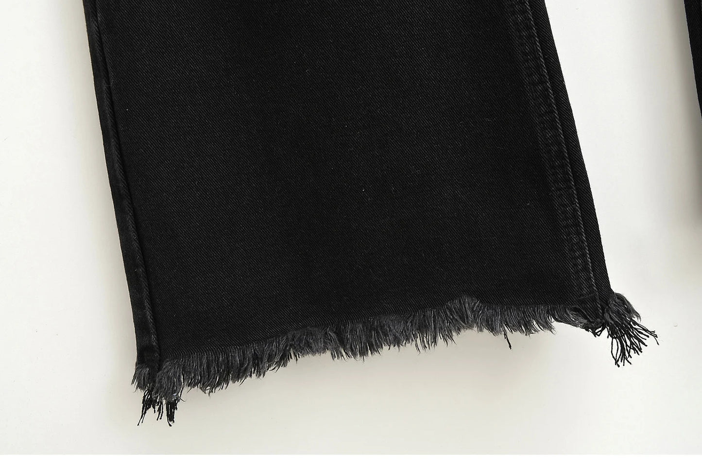 Flared jeans with rips at the knees