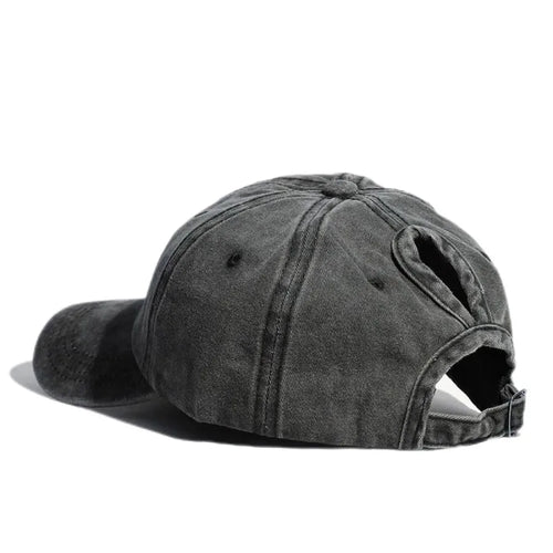 Hat adjusted to the ponytail