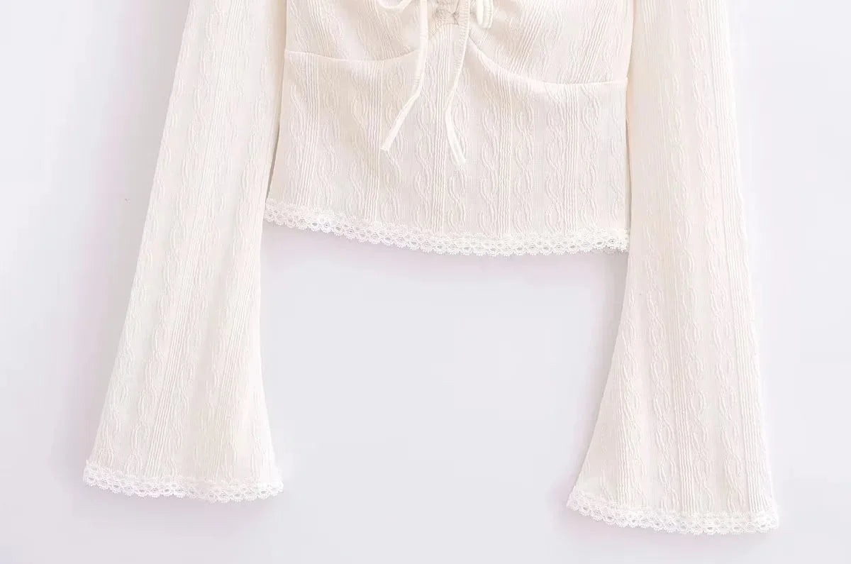 Aesthetic shirt with a tie in the chest and lace decorations