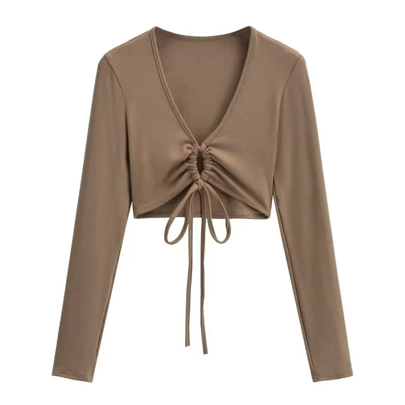 A long shirt with a circle tie in the stomach