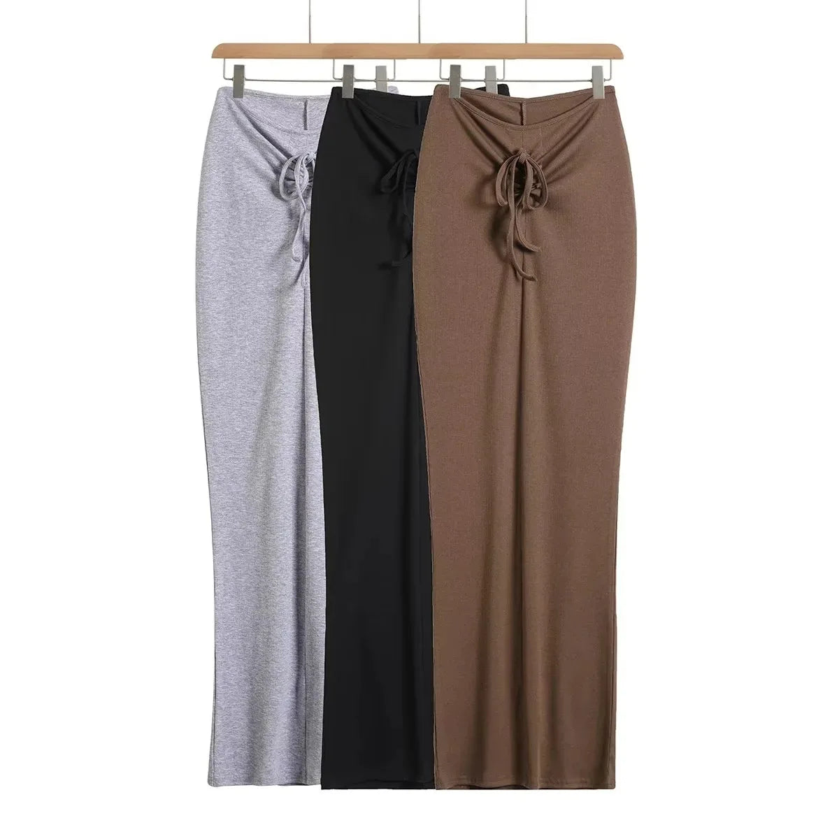 A tight long skirt with a gathered buttock and a front tie