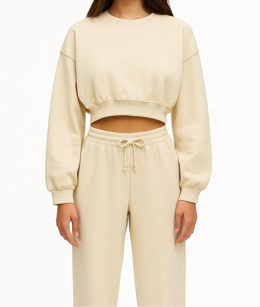 A set of sweatpants and a sweatshirt with a belly cut
