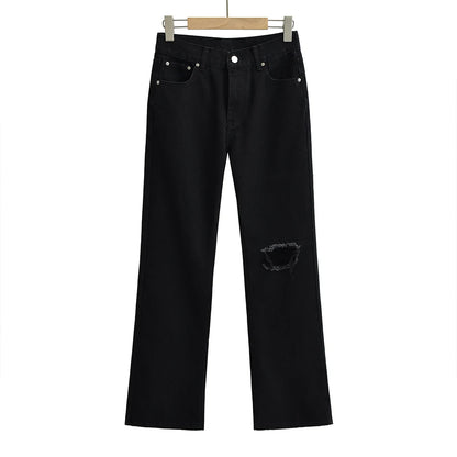 Jeans with a tear in the knee