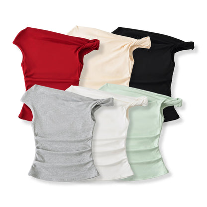 A shirt with a falling shoulder and shirring at the waist