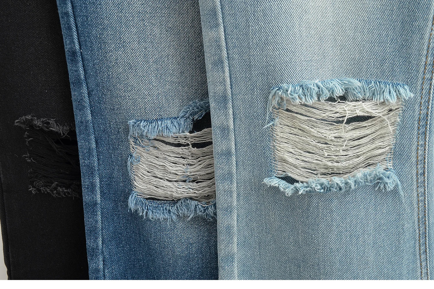 Flared jeans with rips at the knees