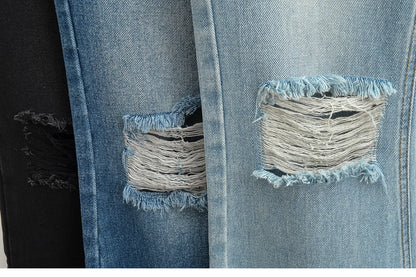 Flared jeans with rips at the knees