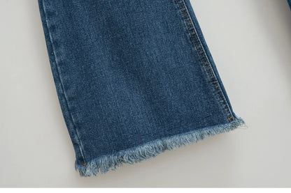 Flared jeans with rips at the knees