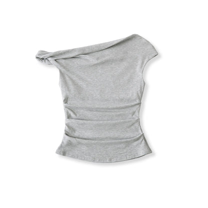 A shirt with a falling shoulder and shirring at the waist