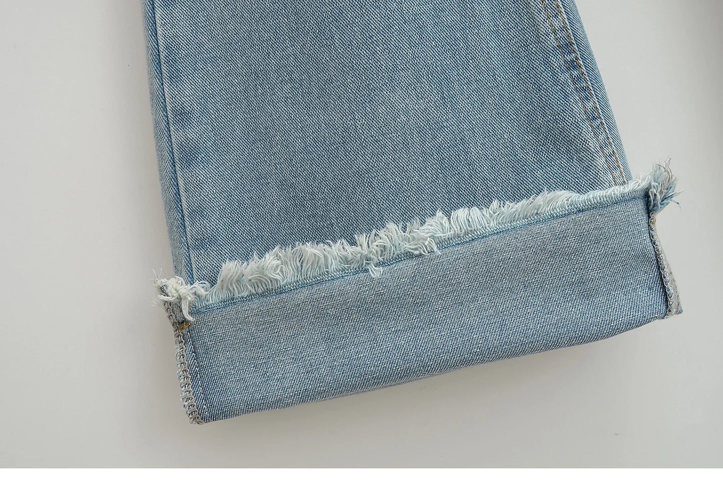 Flared jeans with rips at the knees