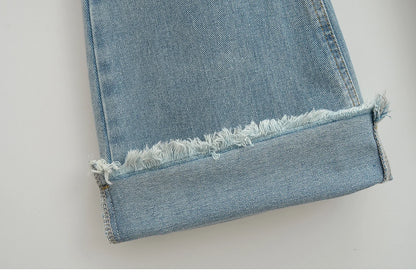 Flared jeans with rips at the knees