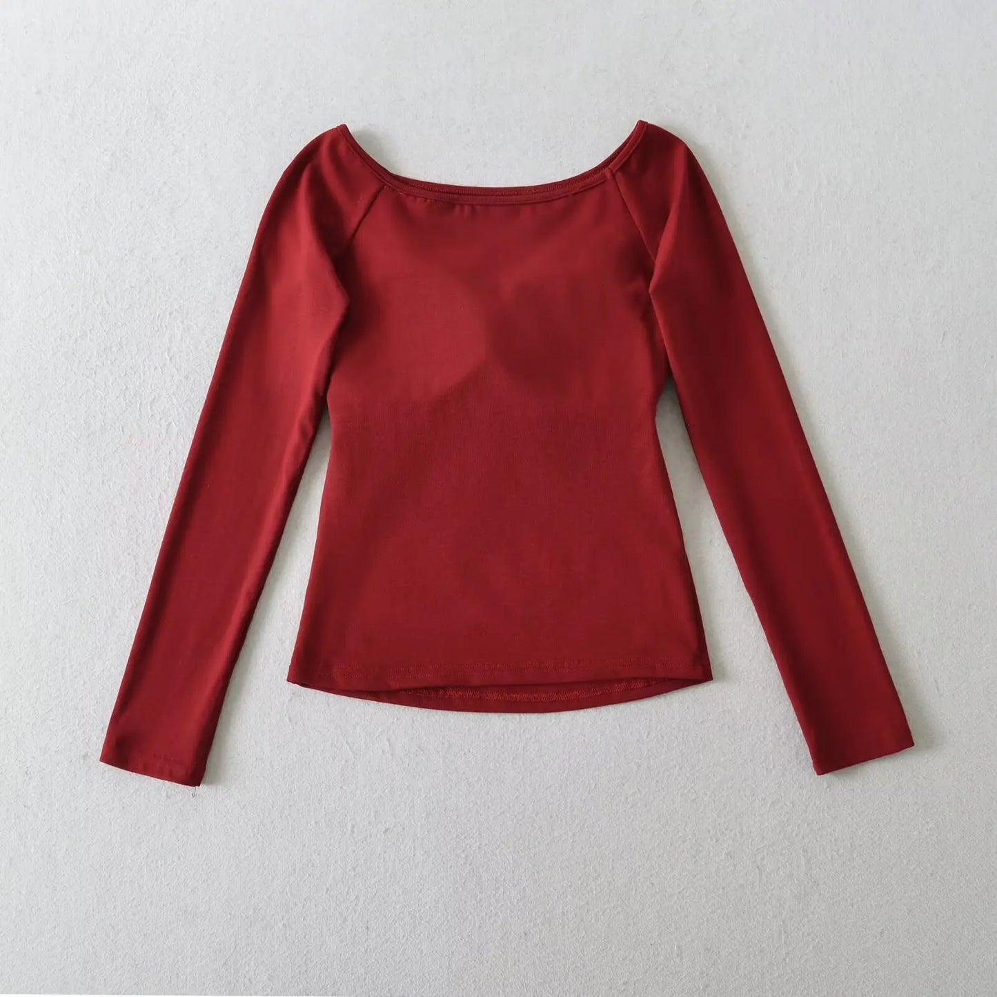 A long shirt with an opening at the neckline and a built-in bra