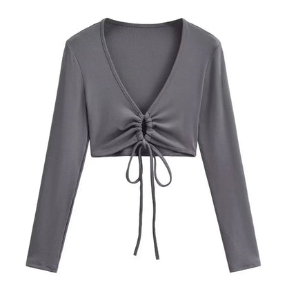 A long shirt with a circle tie in the stomach