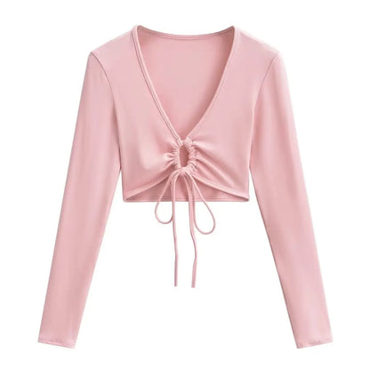 A long shirt with a circle tie in the stomach