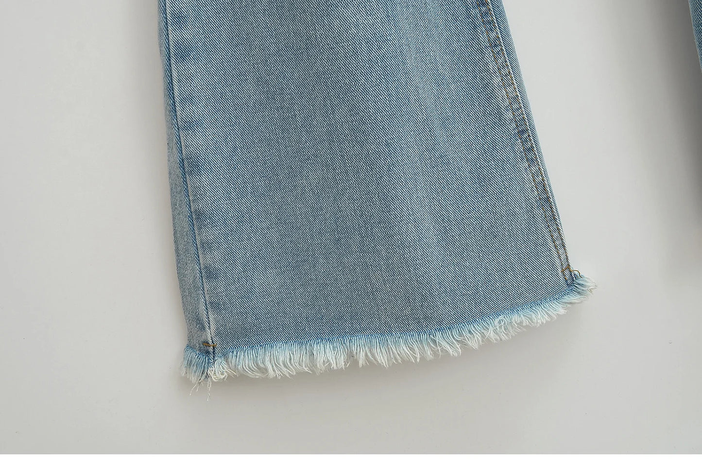 Flared jeans with rips at the knees