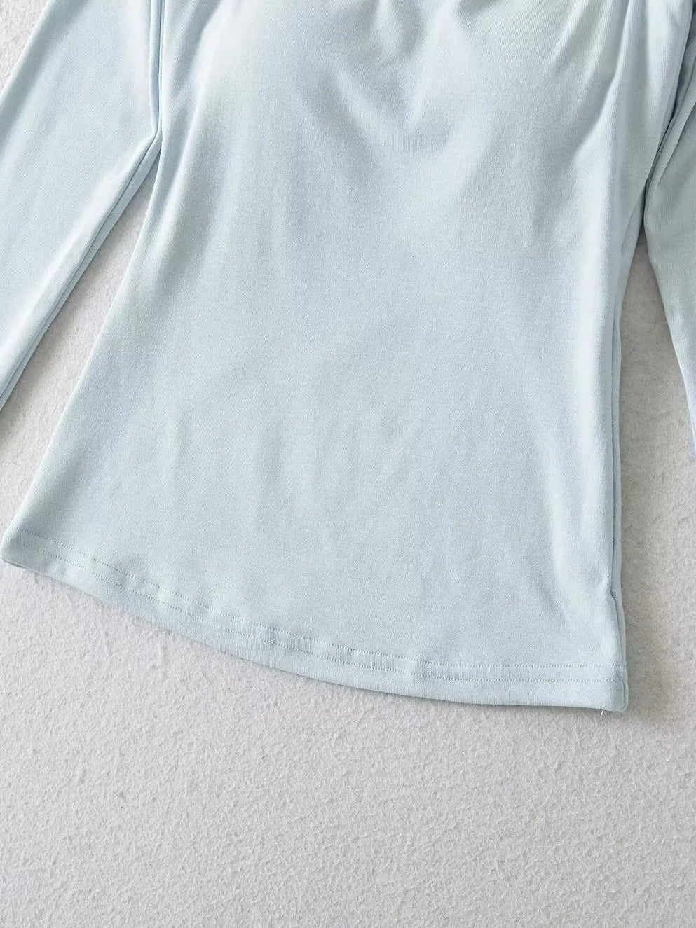 A long shirt with an opening at the neckline and a built-in bra