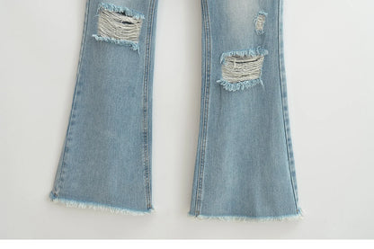Flared jeans with rips at the knees