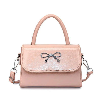 Hand/shoulder bag with bow tie