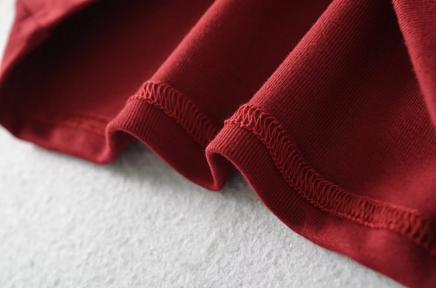 A long shirt with an opening at the neckline and a built-in bra