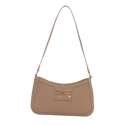 Shoulder bag with gold bow