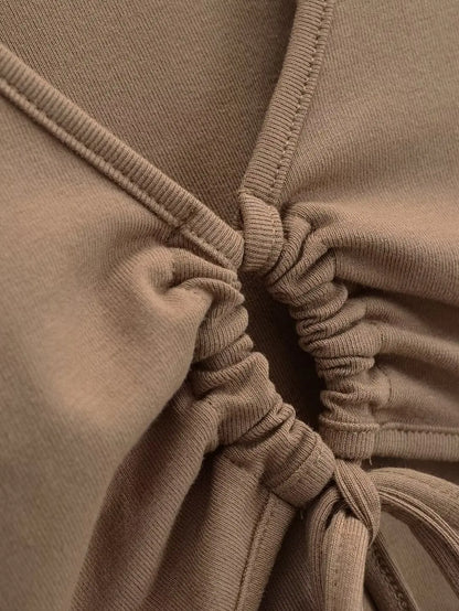 A long shirt with a circle tie in the stomach