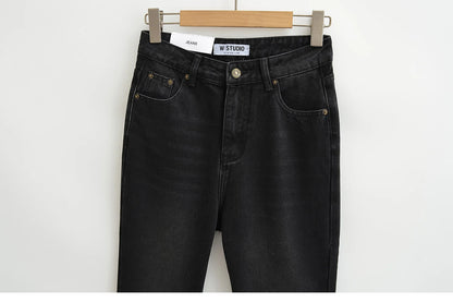 Flared jeans with rips at the knees