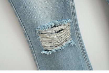Flared jeans with rips at the knees