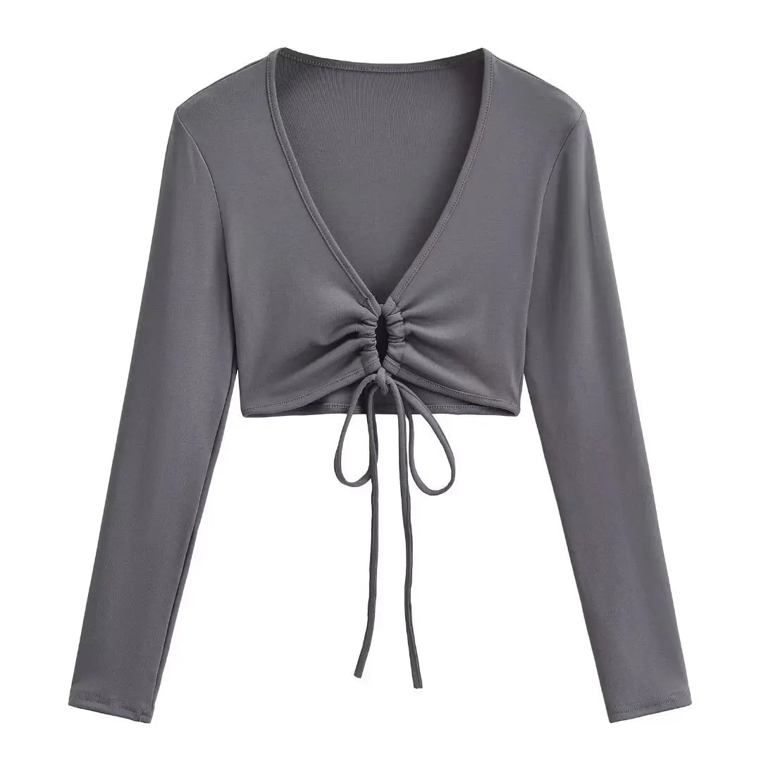A long shirt with a circle tie in the stomach