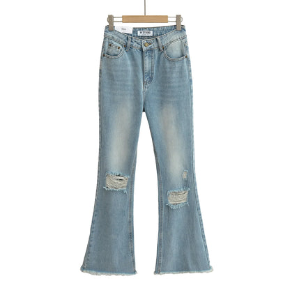 Flared jeans with rips at the knees