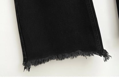 Flared jeans with rips at the knees