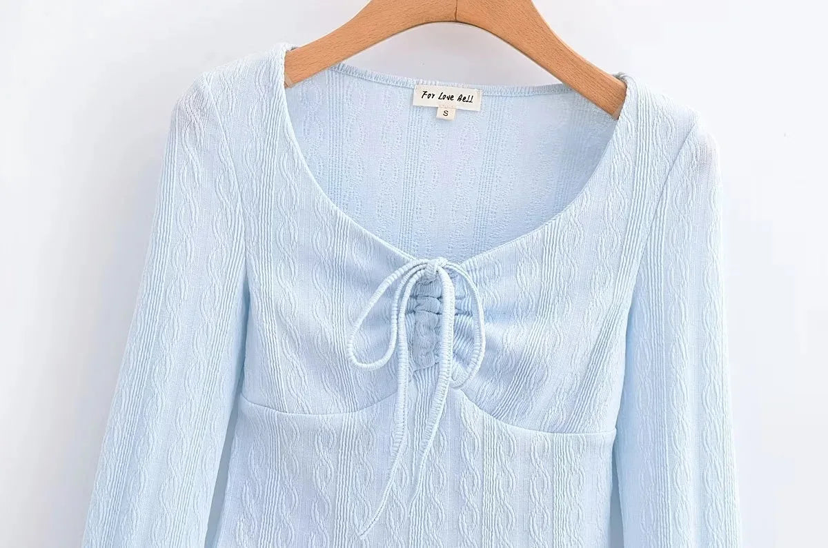 Aesthetic shirt with a tie in the chest and lace decorations