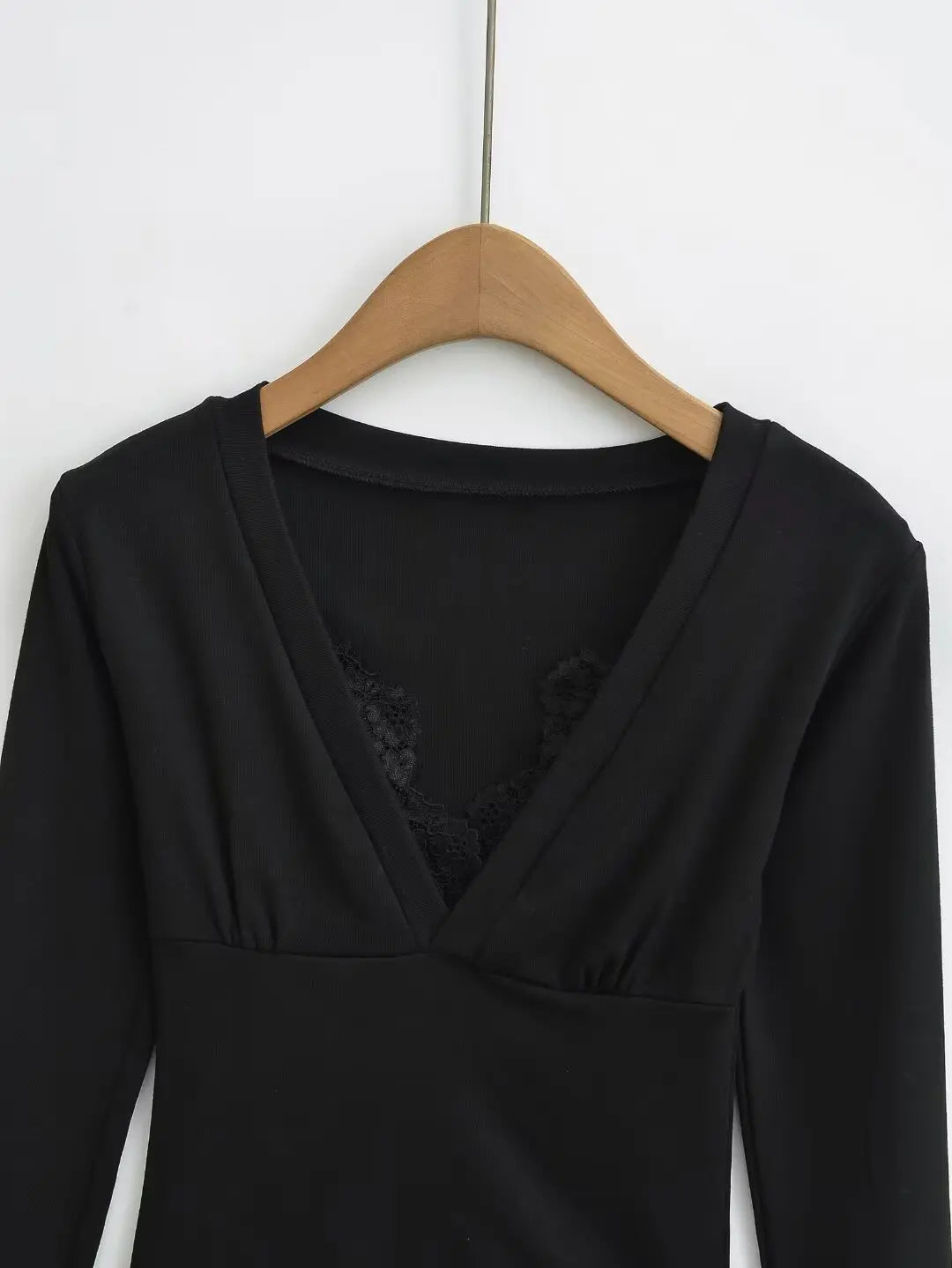 A long shirt with a neckline and protruding lace
