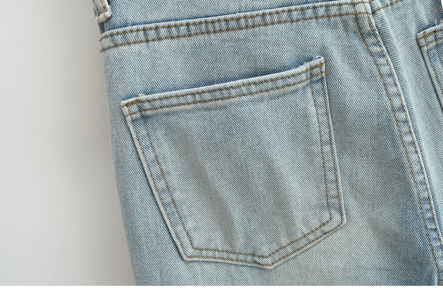 Flared jeans with rips at the knees