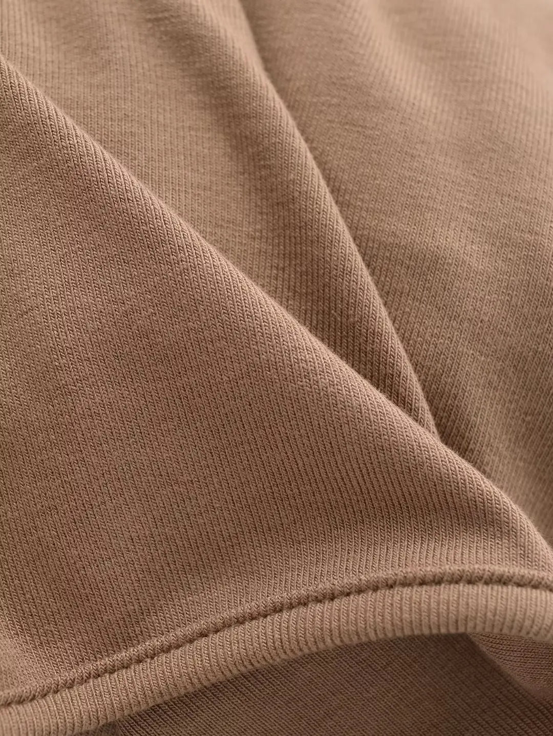 A long camisole is turned at the neckline