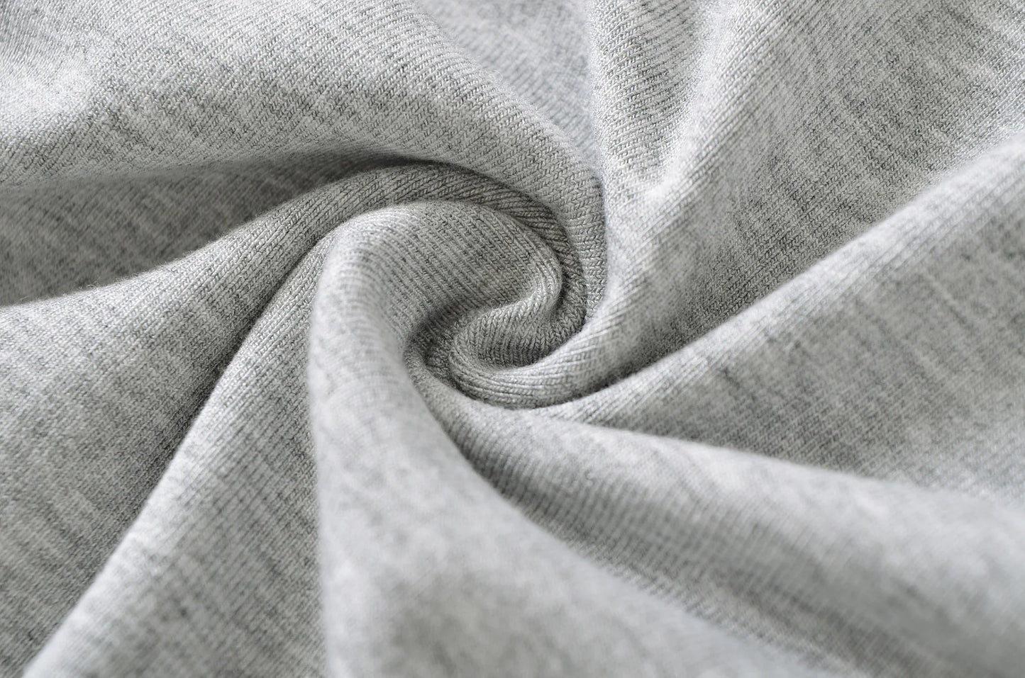 A shirt with a falling shoulder and shirring at the waist