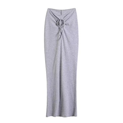 A tight long skirt with a gathered buttock and a front tie