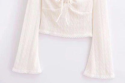 Aesthetic shirt with a tie in the chest and lace decorations