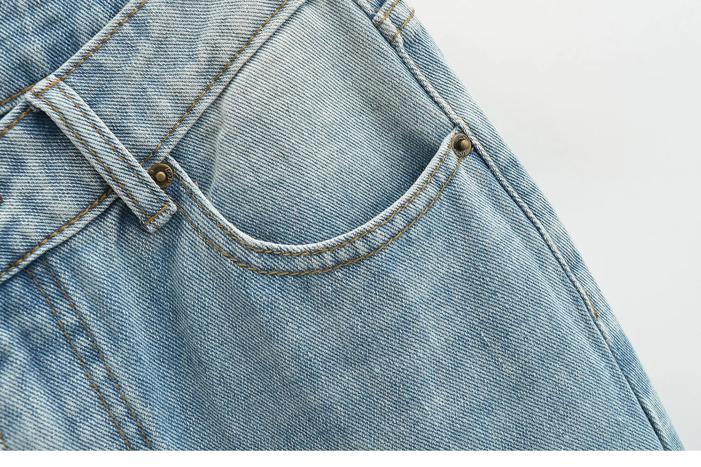 Flared jeans with rips at the knees