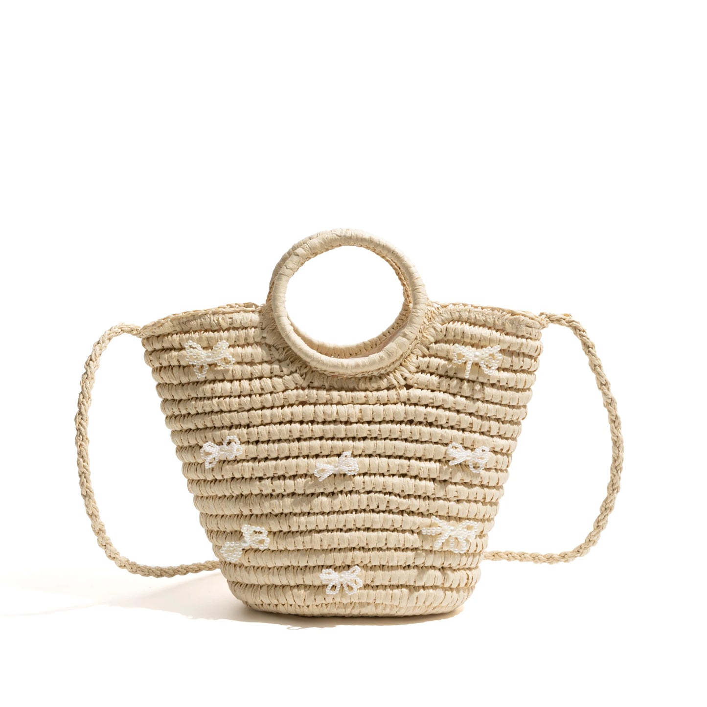 A large straw bag with ribbons