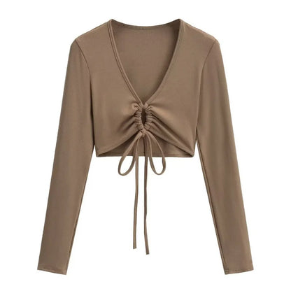 A long shirt with a circle tie in the stomach
