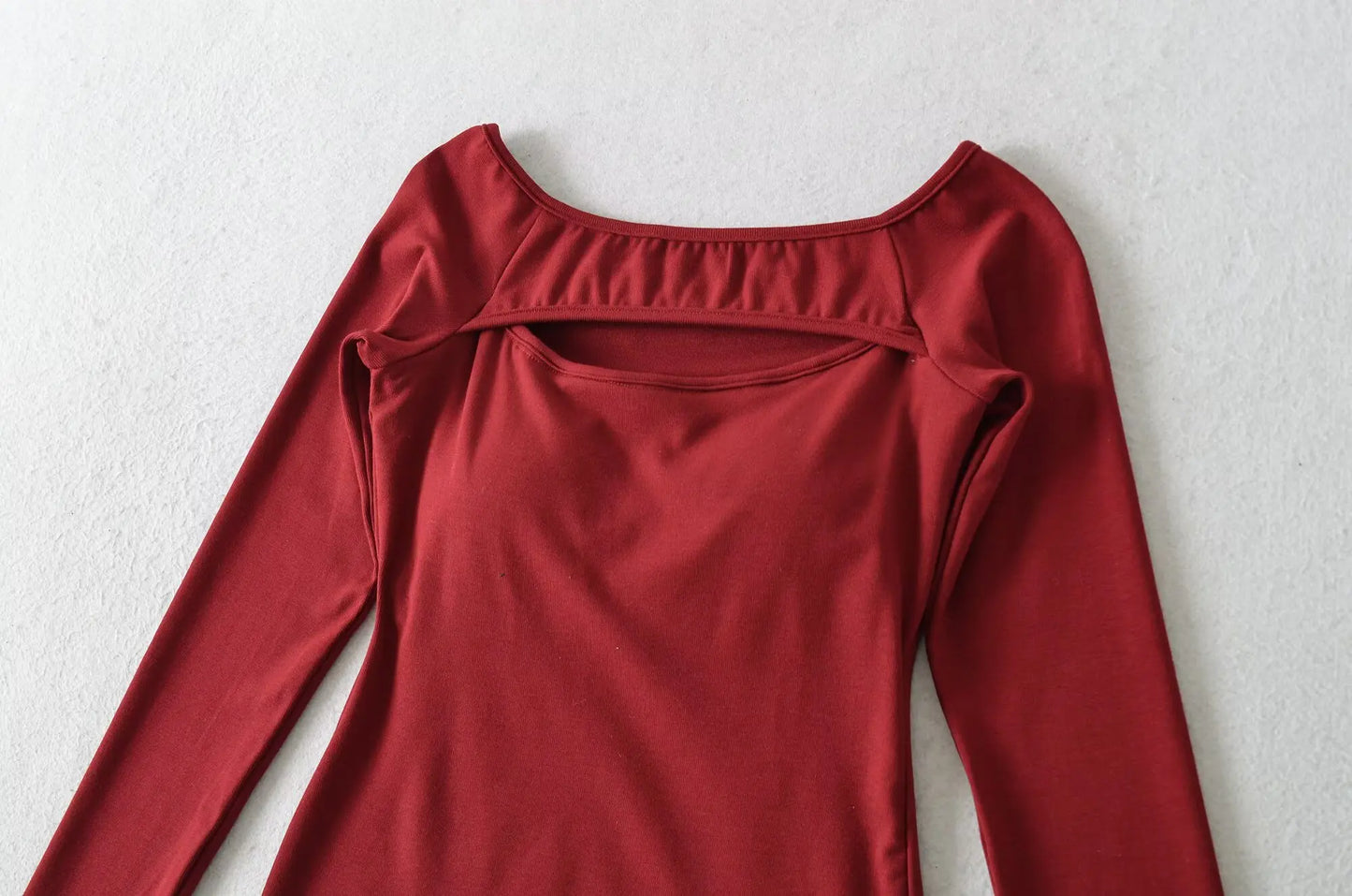 A long shirt with an opening at the neckline and a built-in bra