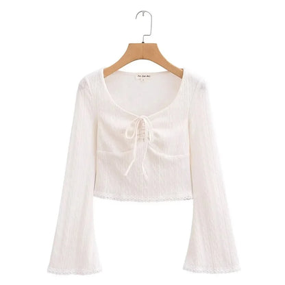 Aesthetic shirt with a tie in the chest and lace decorations