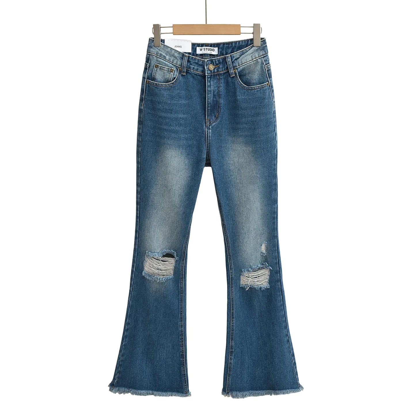 Flared jeans with rips at the knees
