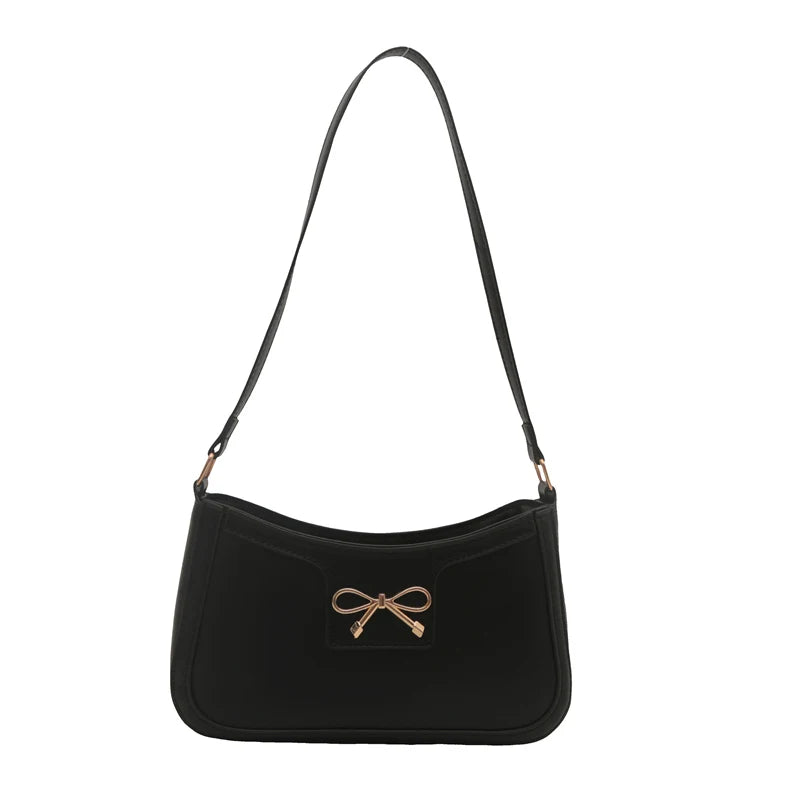 Shoulder bag with gold bow