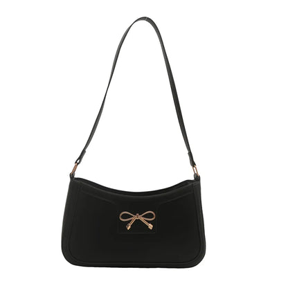 Shoulder bag with gold bow