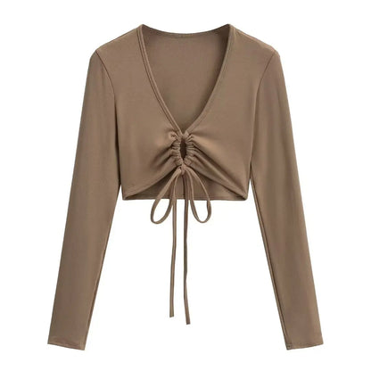 A long shirt with a circle tie in the stomach