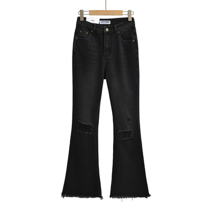 Flared jeans with rips at the knees