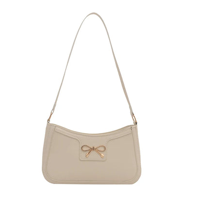 Shoulder bag with gold bow
